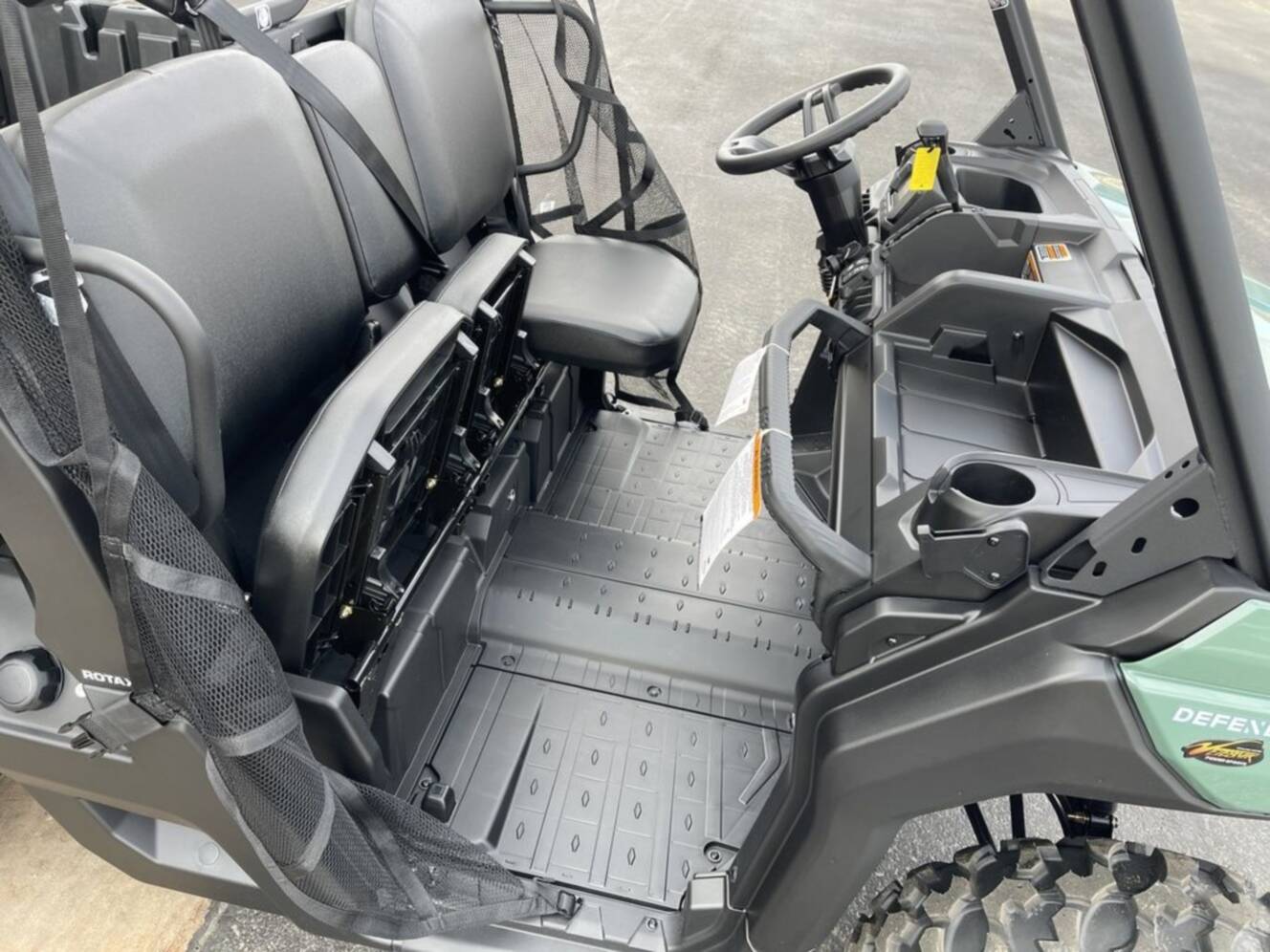 A photo of this 2026 Can-Am Defender DPS HD7 Compass Green