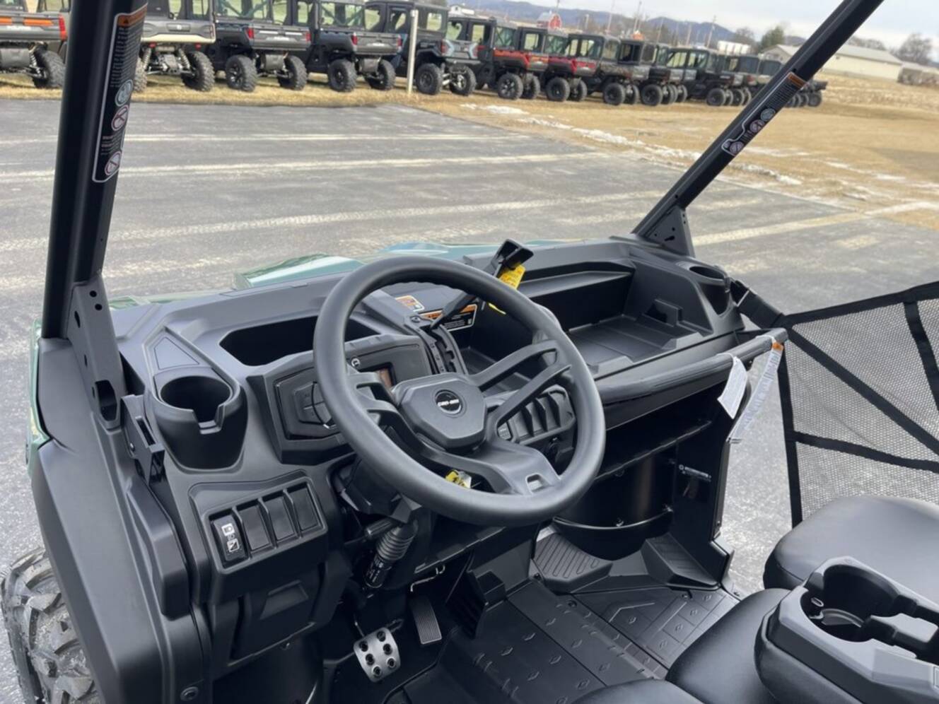 A photo of this 2026 Can-Am Defender DPS HD7 Compass Green