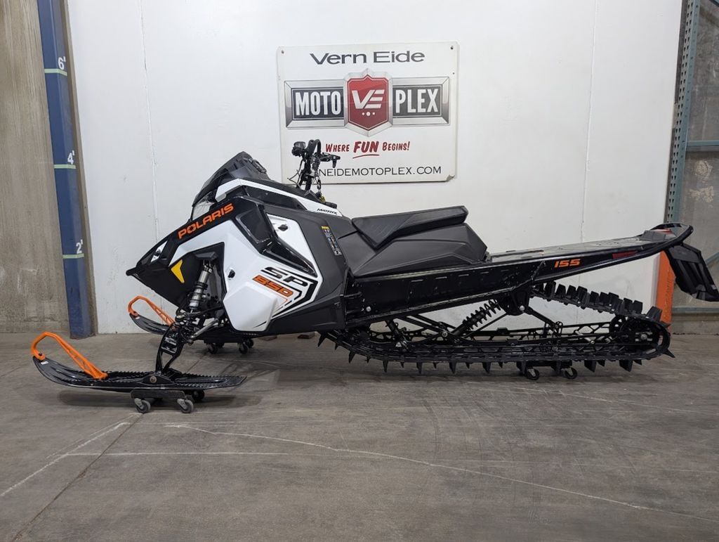 2027 Polaris® 850 RMK SP 155 White Lightning / Gloss Black / Orange B 850 155 in sioux falls SD