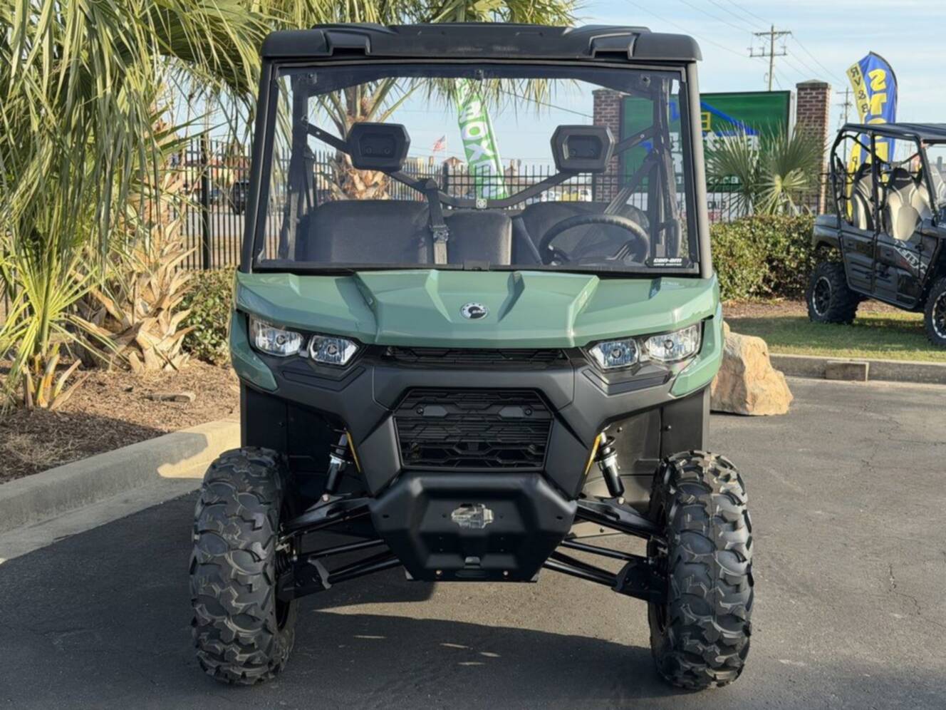 A photo of this 2026 Can-Am Defender DPS HD7 Compass Green