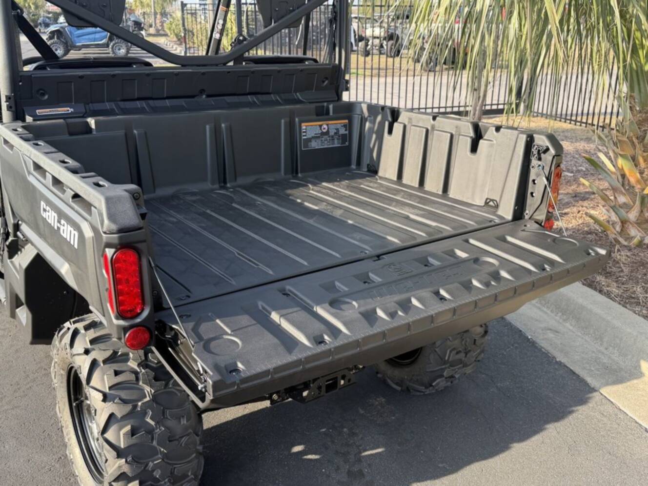 A photo of this 2026 Can-Am Defender DPS HD7 Compass Green