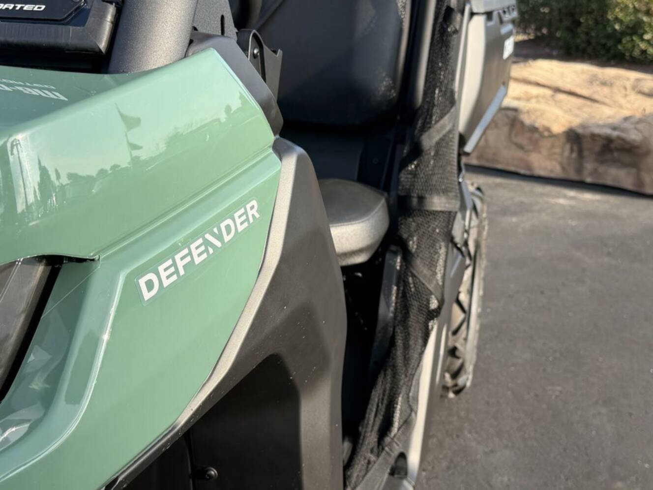 A photo of this 2026 Can-Am Defender DPS HD7 Compass Green