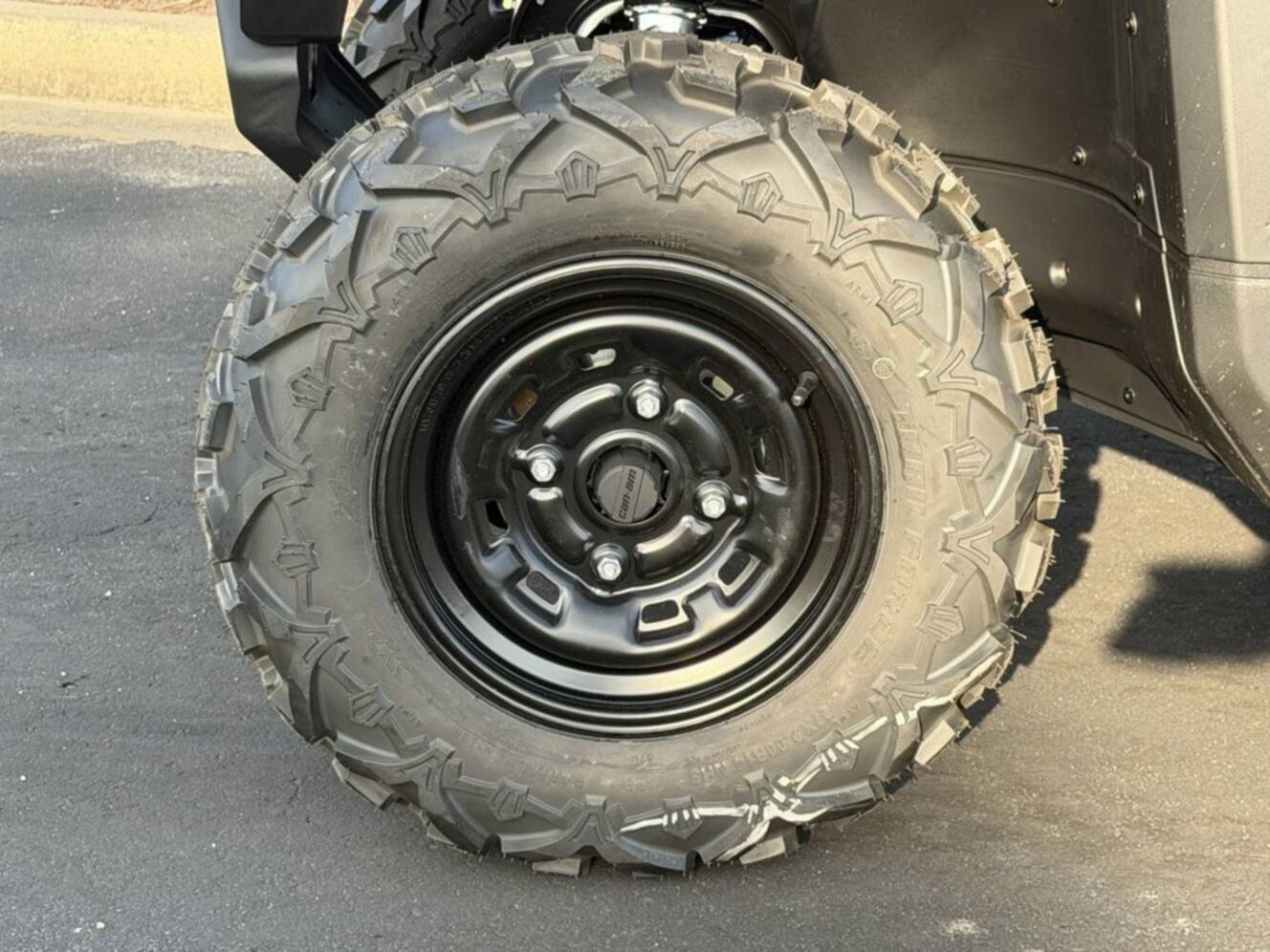A photo of this 2026 Can-Am Defender DPS HD7 Compass Green