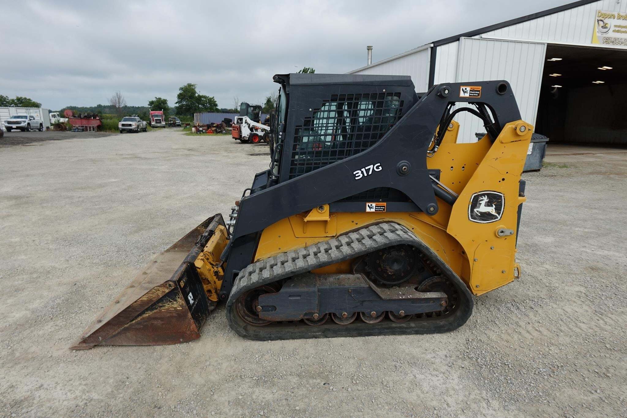 2024 DEERE 317G in Versailles, OH