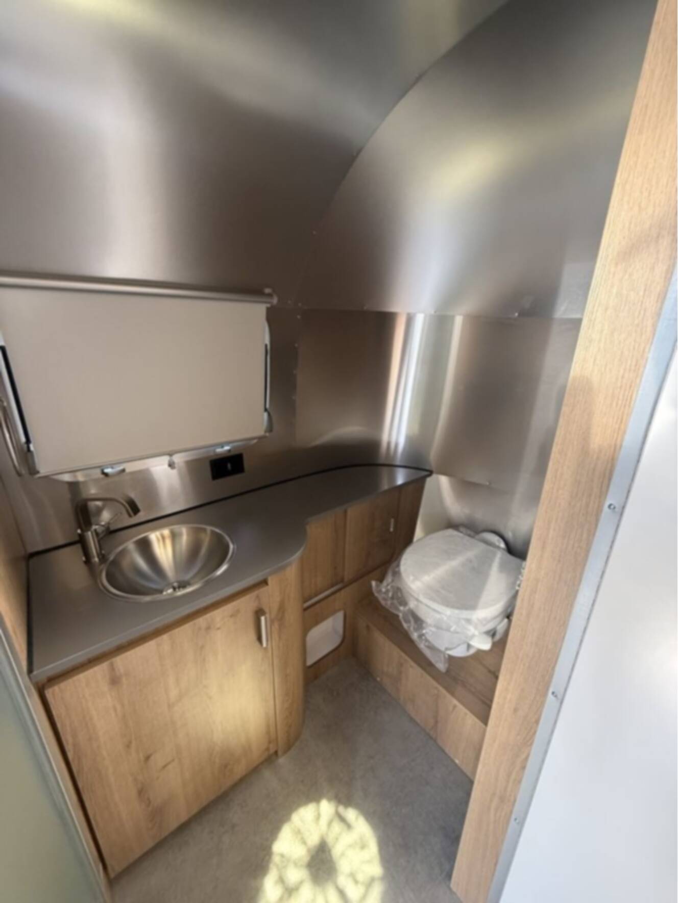A photo of this 2026 Airstream Trade Wind 23FB
