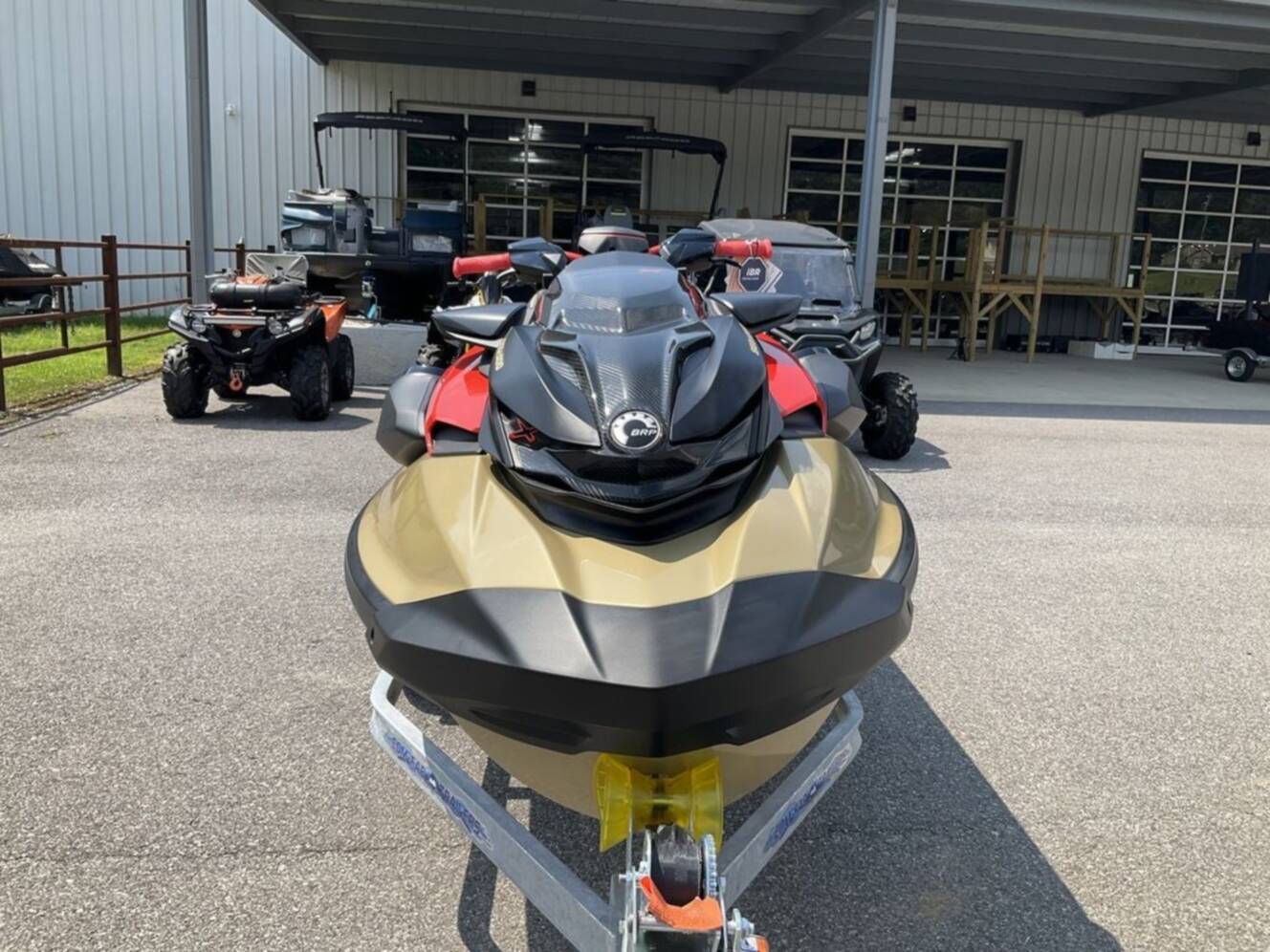 A photo of this 2025 Sea-Doo RXP-X 325 Tech, BRP Premium A, iBR Metallic Tan / La