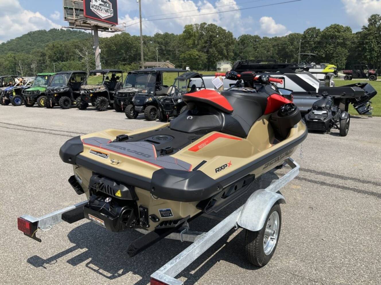 A photo of this 2025 Sea-Doo RXP-X 325 Tech, BRP Premium A, iBR Metallic Tan / La