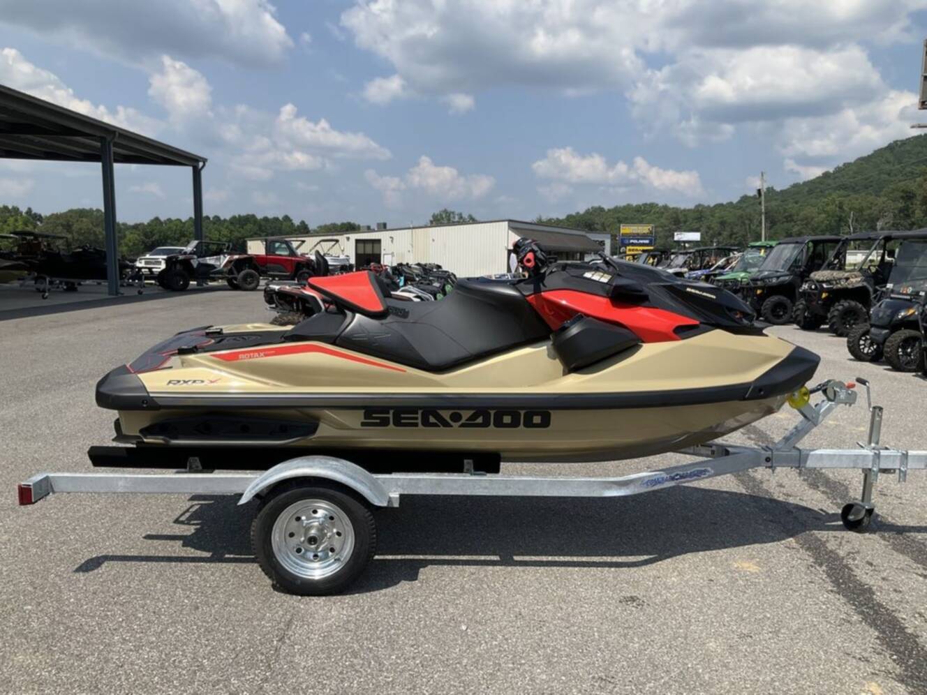 A photo of this 2025 Sea-Doo RXP-X 325 Tech, BRP Premium A, iBR Metallic Tan / La