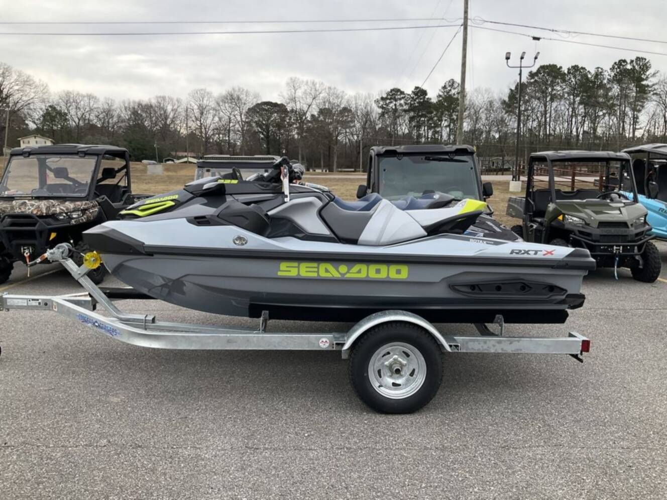 A photo of this 2026 Sea-Doo RXT-X 325 Ice Metal / Manta Green