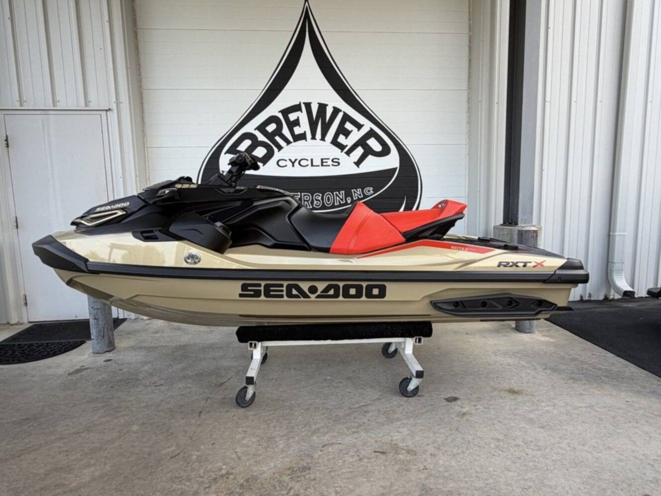 A photo of this 2025 Sea-Doo RXT-X 325 Metallic Tan / Lava Red Premium