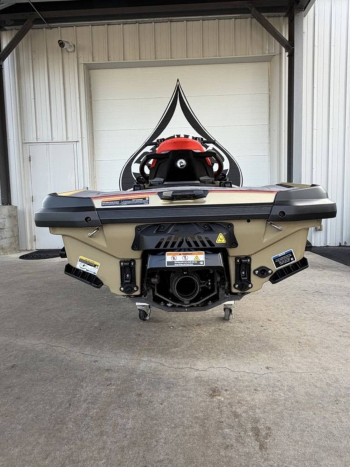 A photo of this 2025 Sea-Doo RXT-X 325 Metallic Tan / Lava Red Premium