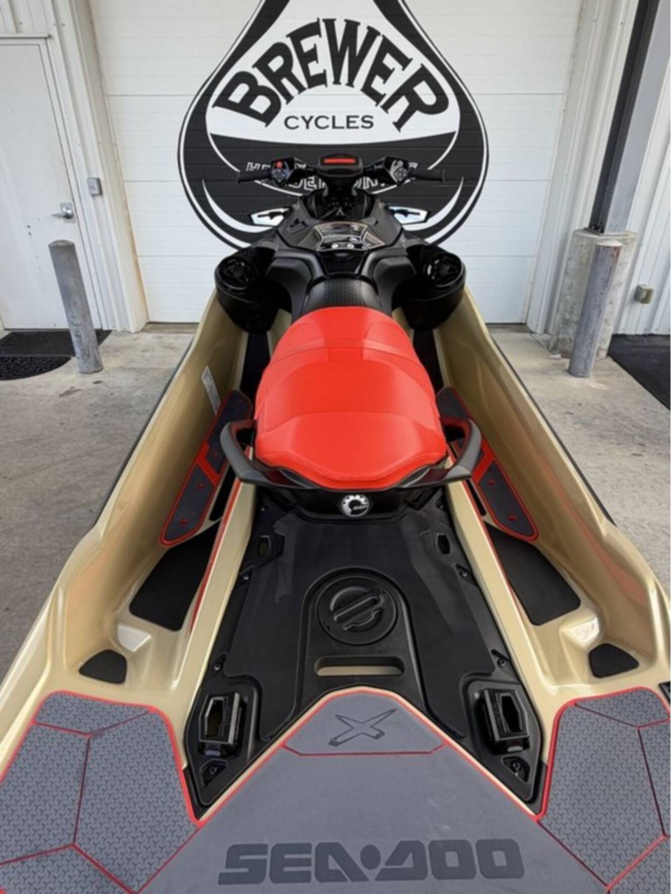 A photo of this 2025 Sea-Doo RXT-X 325 Metallic Tan / Lava Red Premium