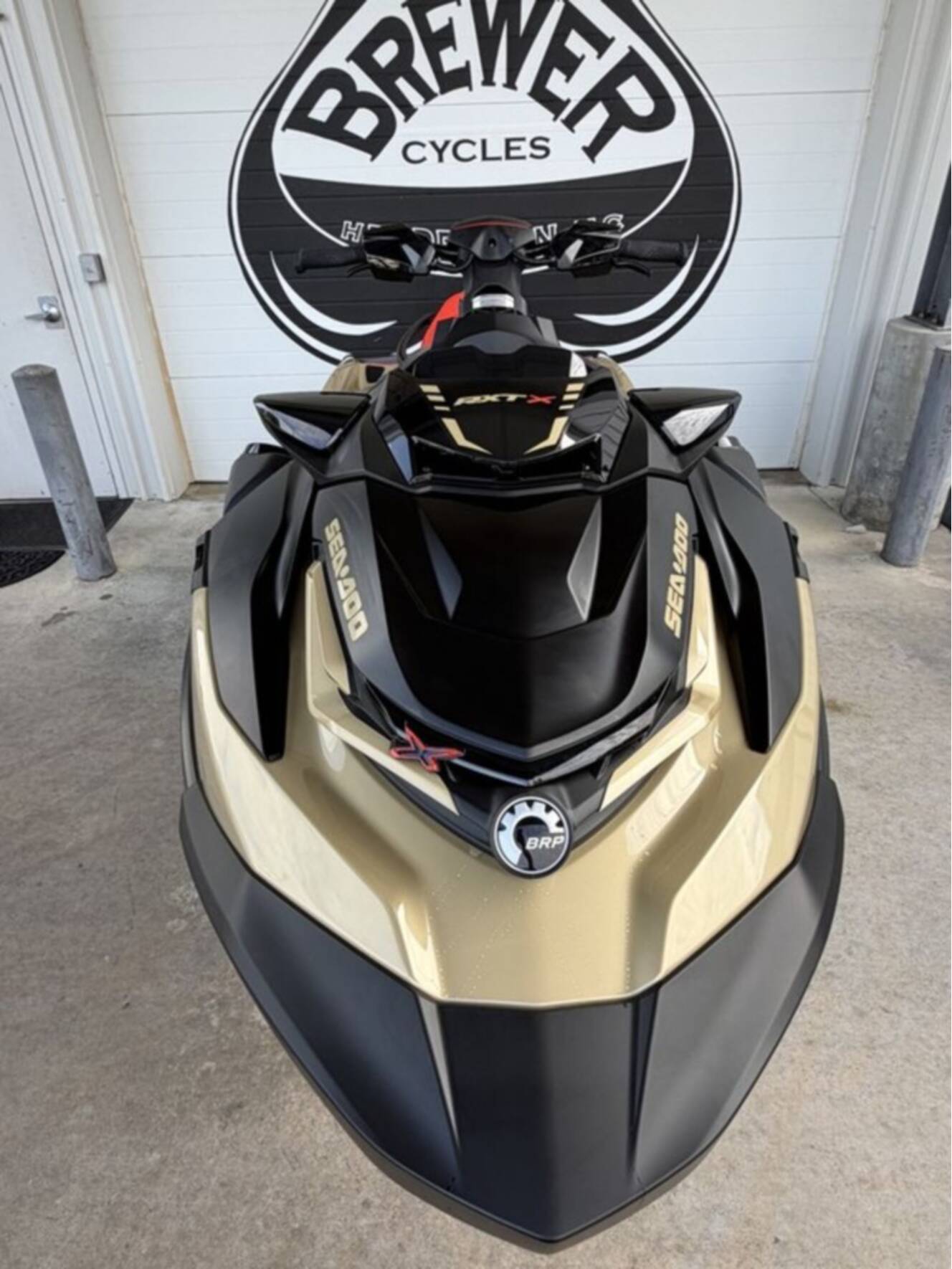 A photo of this 2025 Sea-Doo RXT-X 325 Metallic Tan / Lava Red Premium