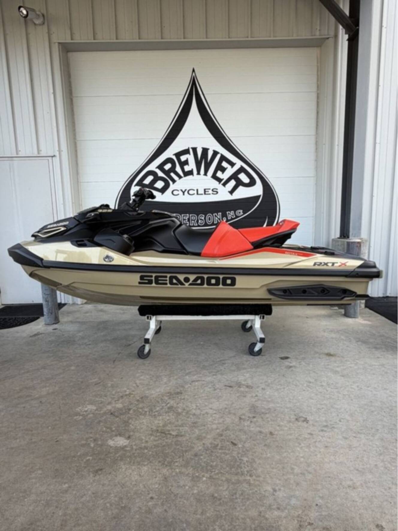 A photo of this 2025 Sea-Doo RXT-X 325 Metallic Tan / Lava Red Premium