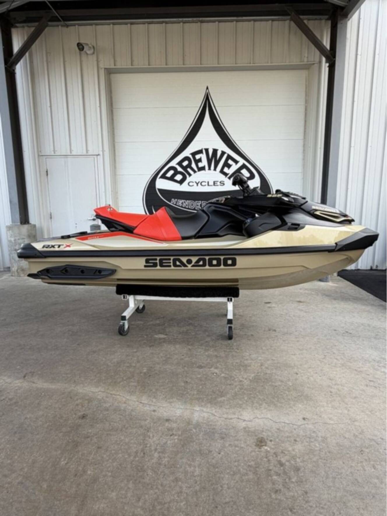 A photo of this 2025 Sea-Doo RXT-X 325 Metallic Tan / Lava Red Premium